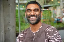 Richard von Weizsäcker Fellow Kumi Naidoo laughing into the camera