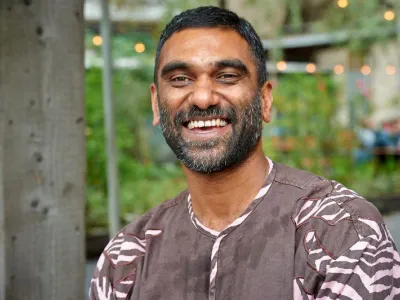 Richard von Weizsäcker Fellow Kumi Naidoo laughing into the camera